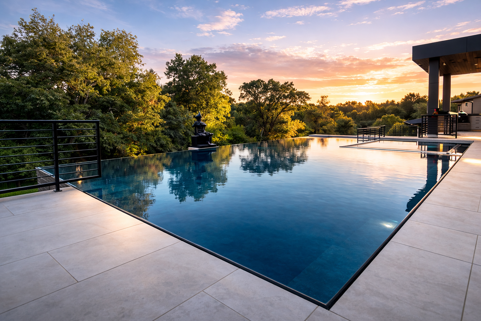 Stunning infinity edge ICF pool at sunset with tree line reflection