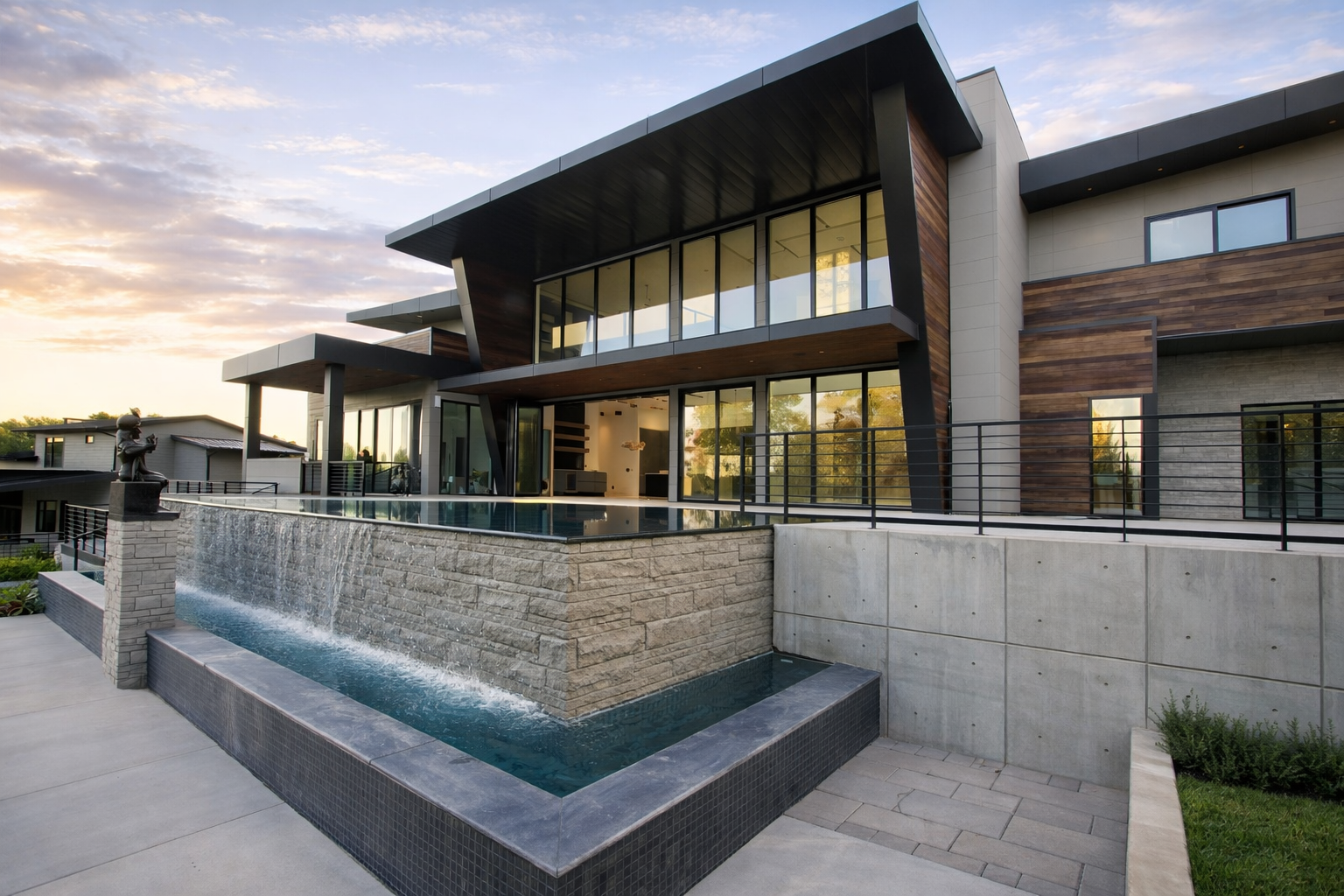Modern contemporary home with elevated infinity pool and waterfall feature